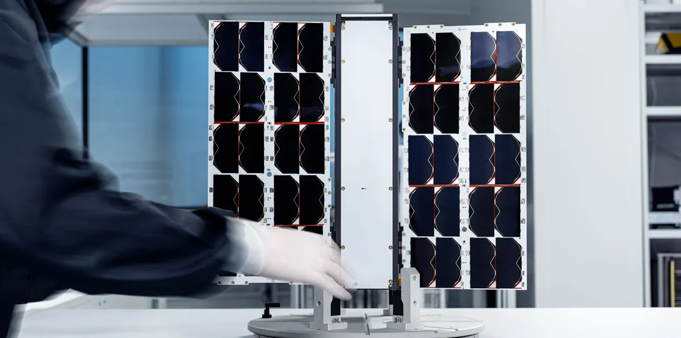 EnduroSat 8u cubesat standing on test platform with integrated solar panels