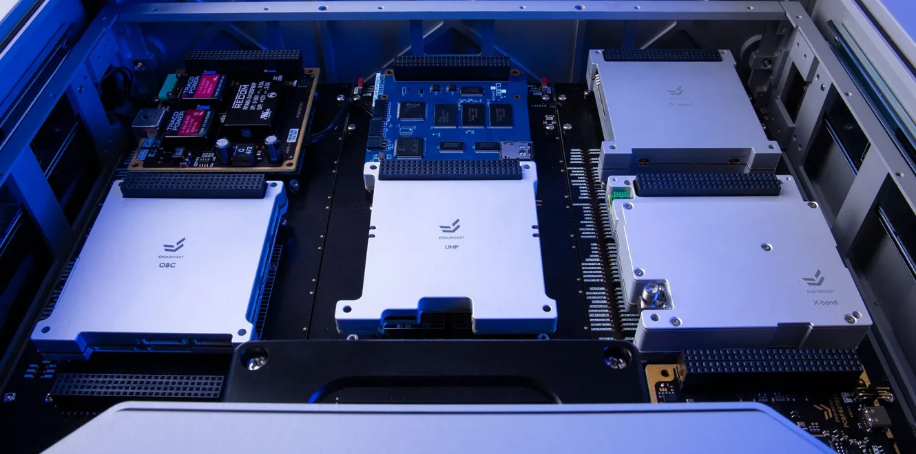 EnduroSat DeskSat flatsat internal layout showing integrated satellite subsystems including OBC, UHF, and X-band modules for system-level testing