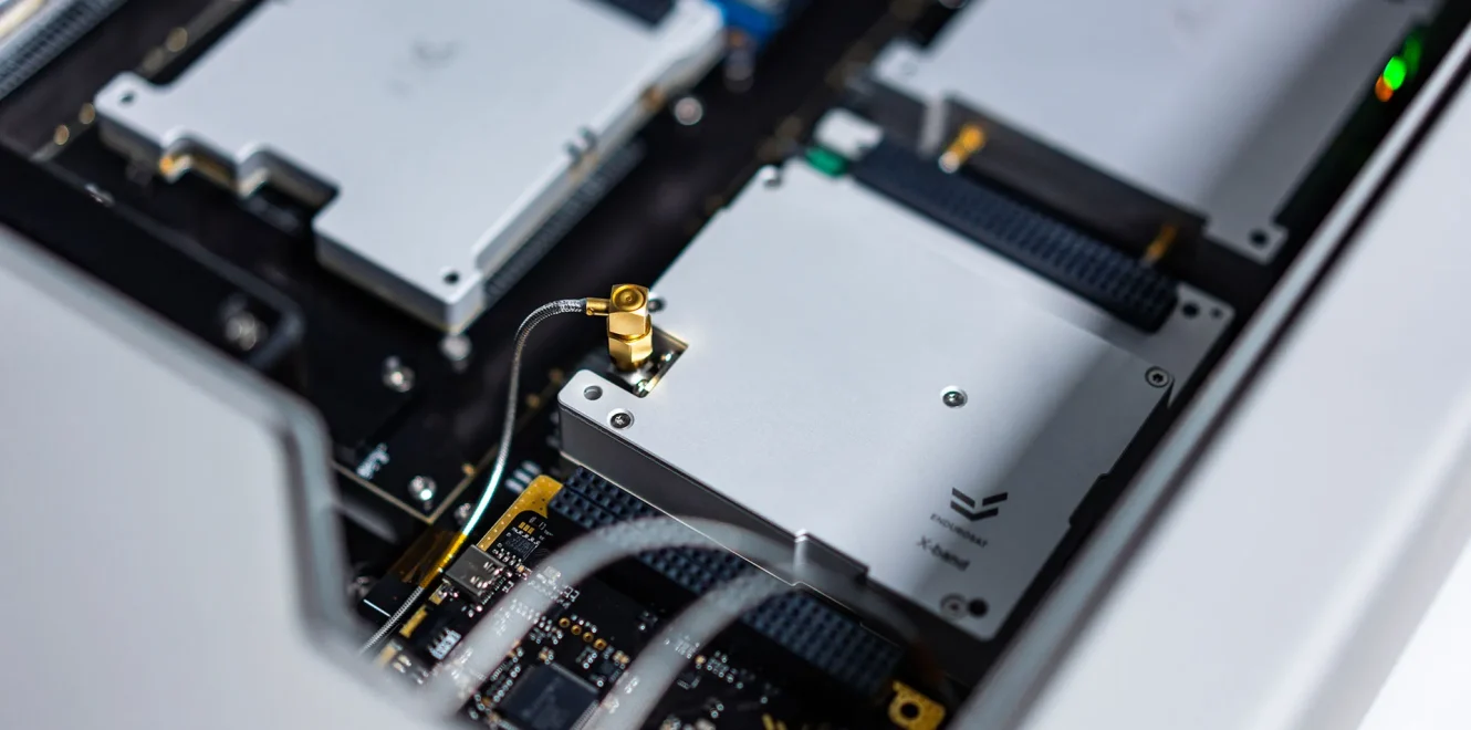 EnduroSat DeskSat flatsat close-up showing internal RF module and connected electronics used for satellite subsystem integration and testing
