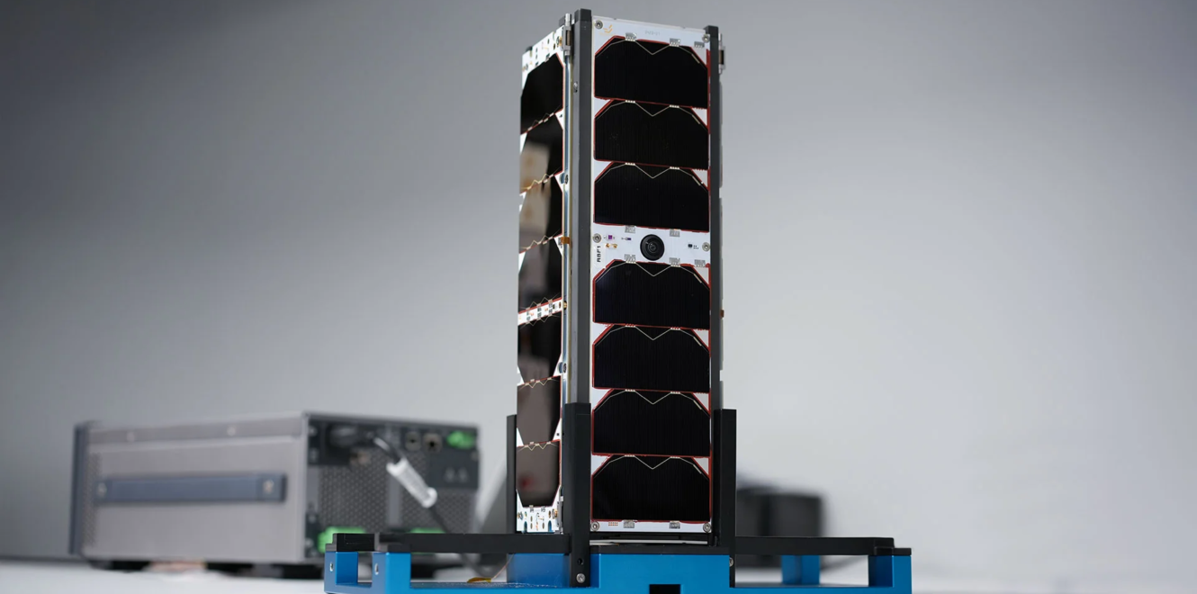 Diagonal view of undeployed 3U Deployable Solar Panel placed on a lab table with light grey background
