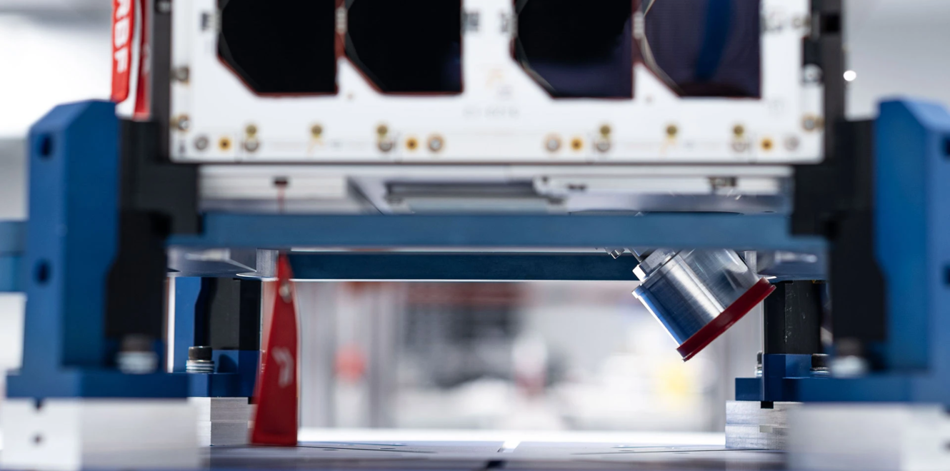 16 cubesat mounted on a vibration test fixture during mechanical qualification testing