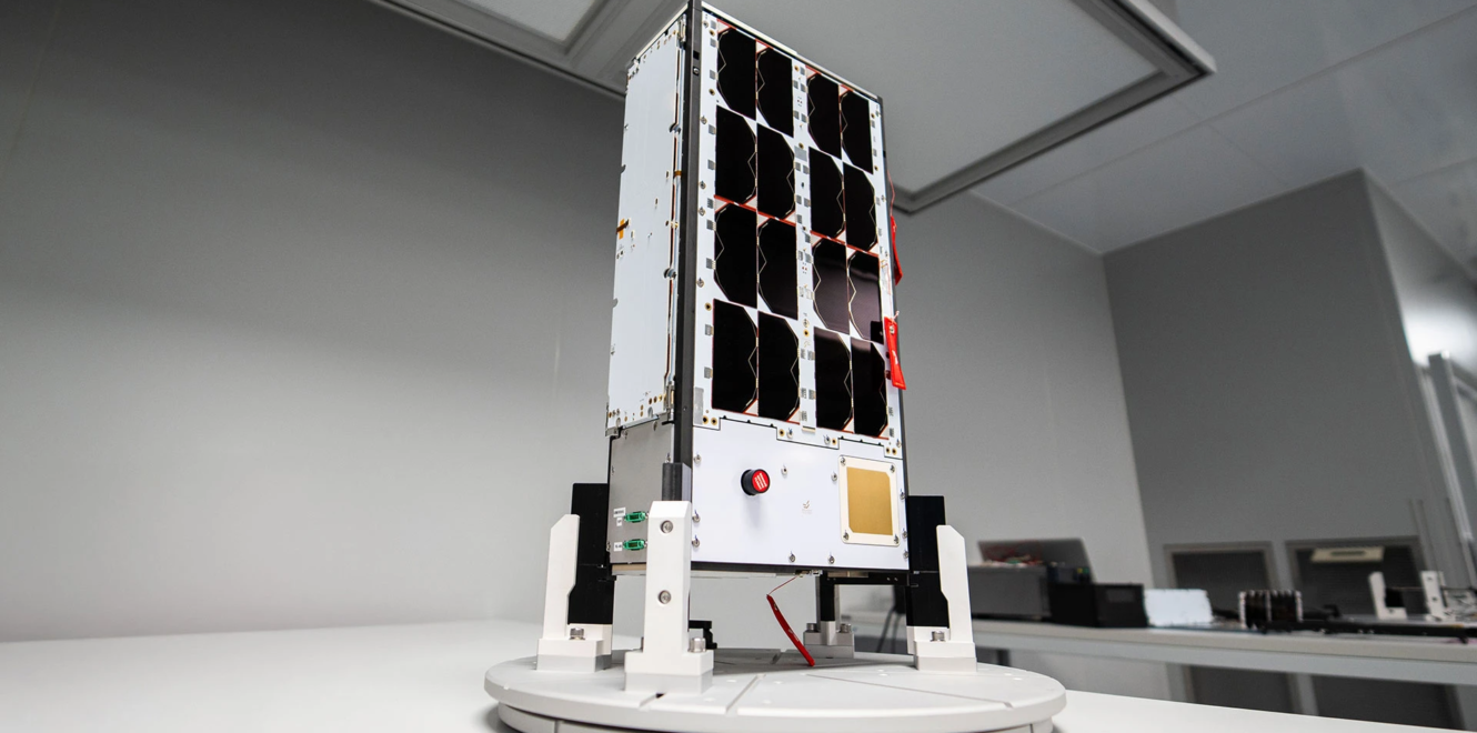EnduroSat 8u cubesat positioned on mechanical stand with visible subsystem panels