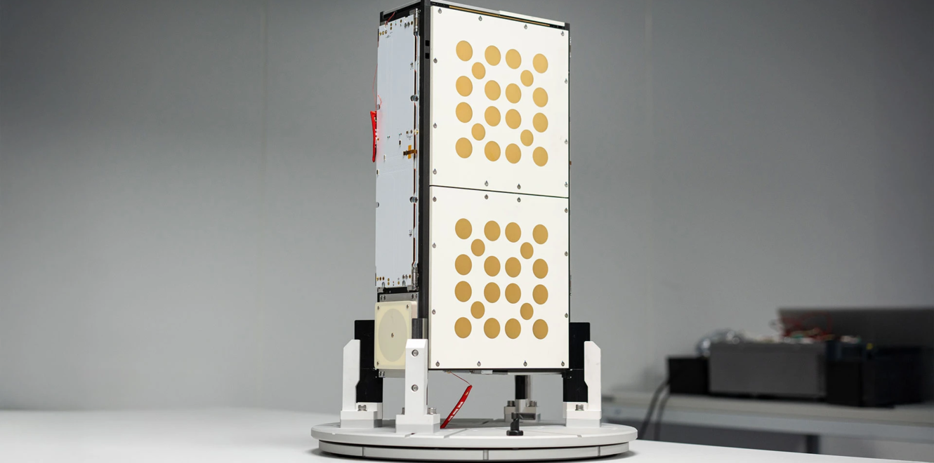 Isolated view of 8u cubesat during laboratory inspection on rotation platform
