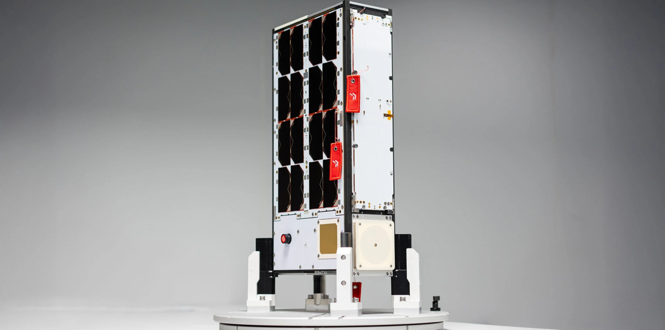 EnduroSat 8u cubesat standing on test platform with integrated solar panels