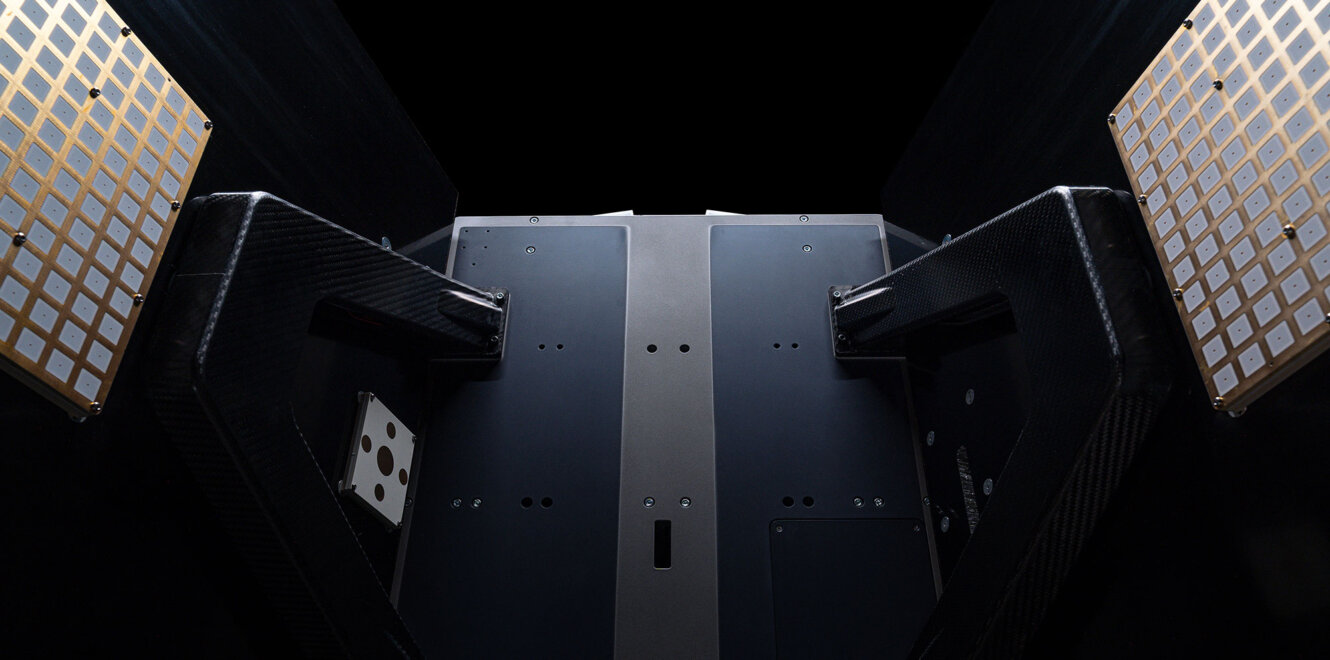 EnduroSat ESPA-Class Satellite rear view showing dual deployable solar arrays and reinforced structural support arms